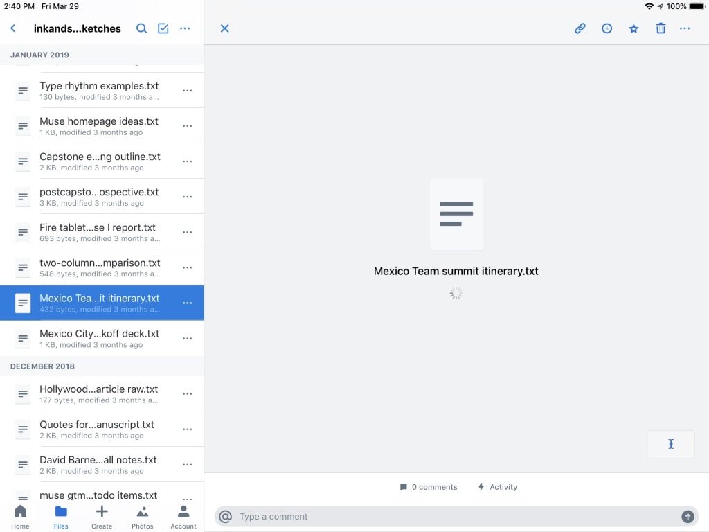 The Dropbox mobile app showing a spinner while waiting to download a file
